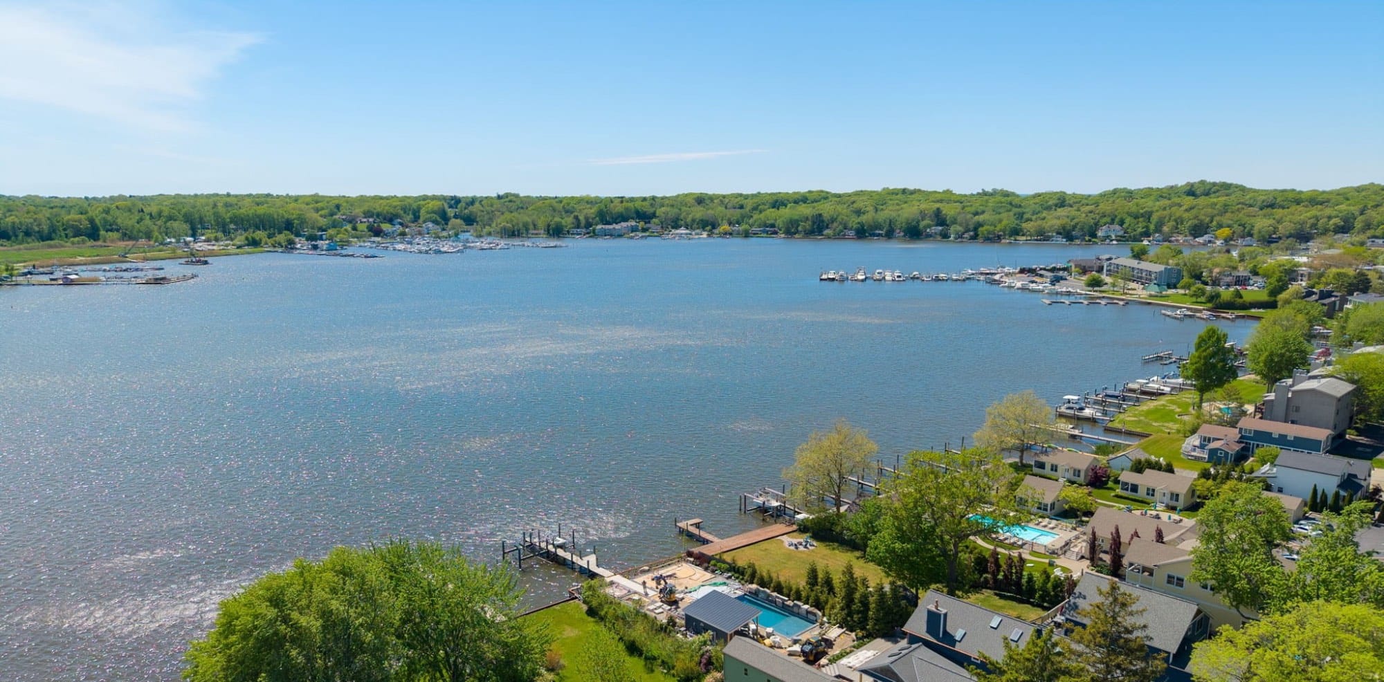 Aerial view of a West Michigan lake with docks and lakeshore homes